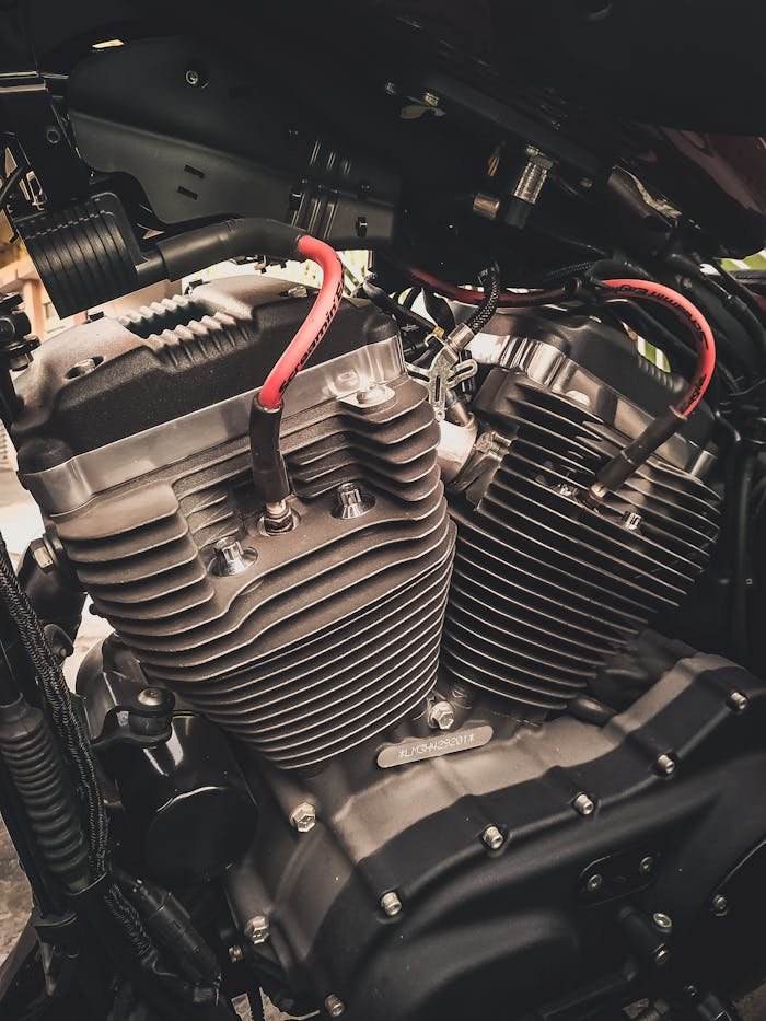 about-01 Detailed view of a motorcycle engine showcasing intricate mechanical parts and design.