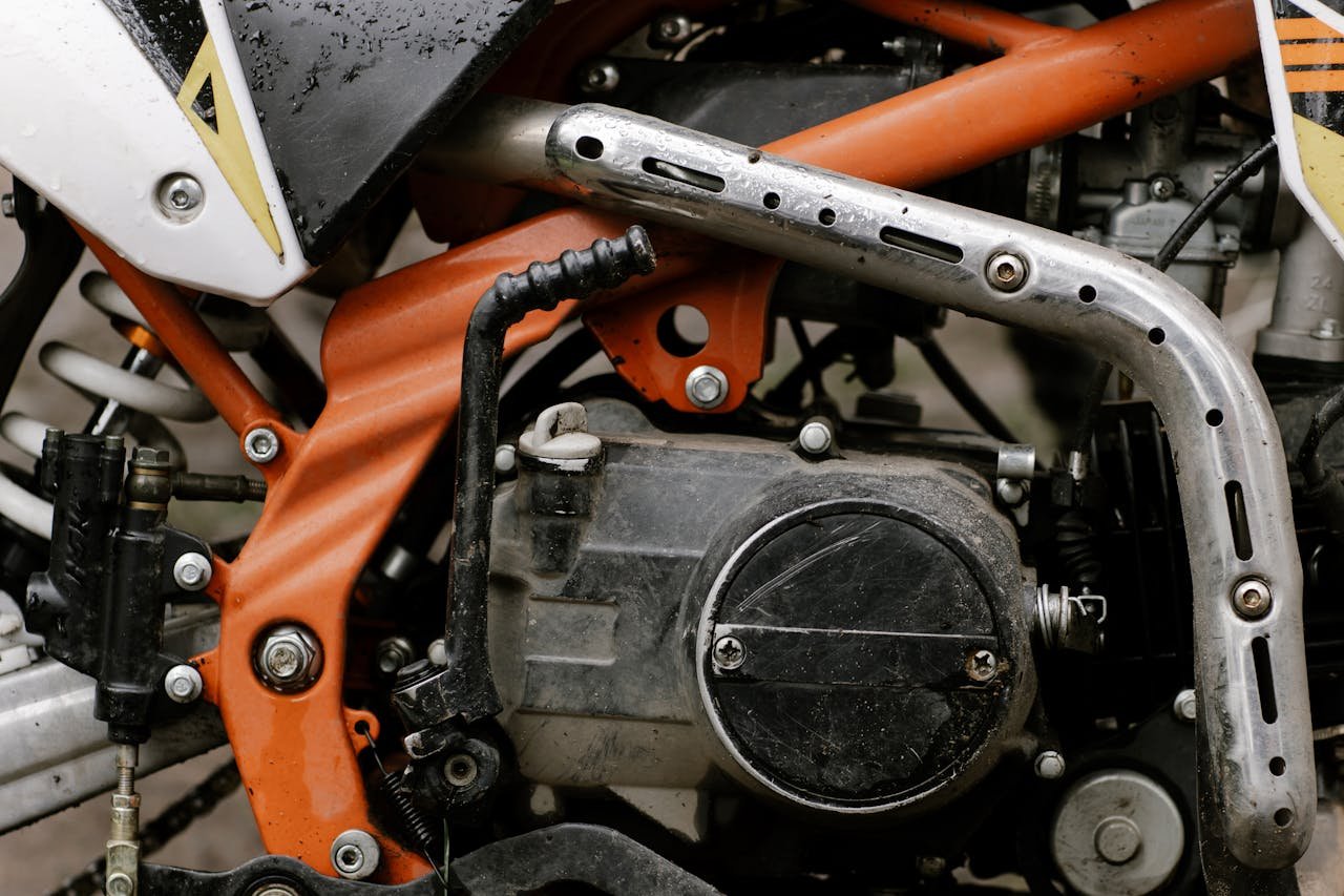 our-services-1 Detailed close-up of motorcycle engine showcasing mechanical components and craftsmanship.